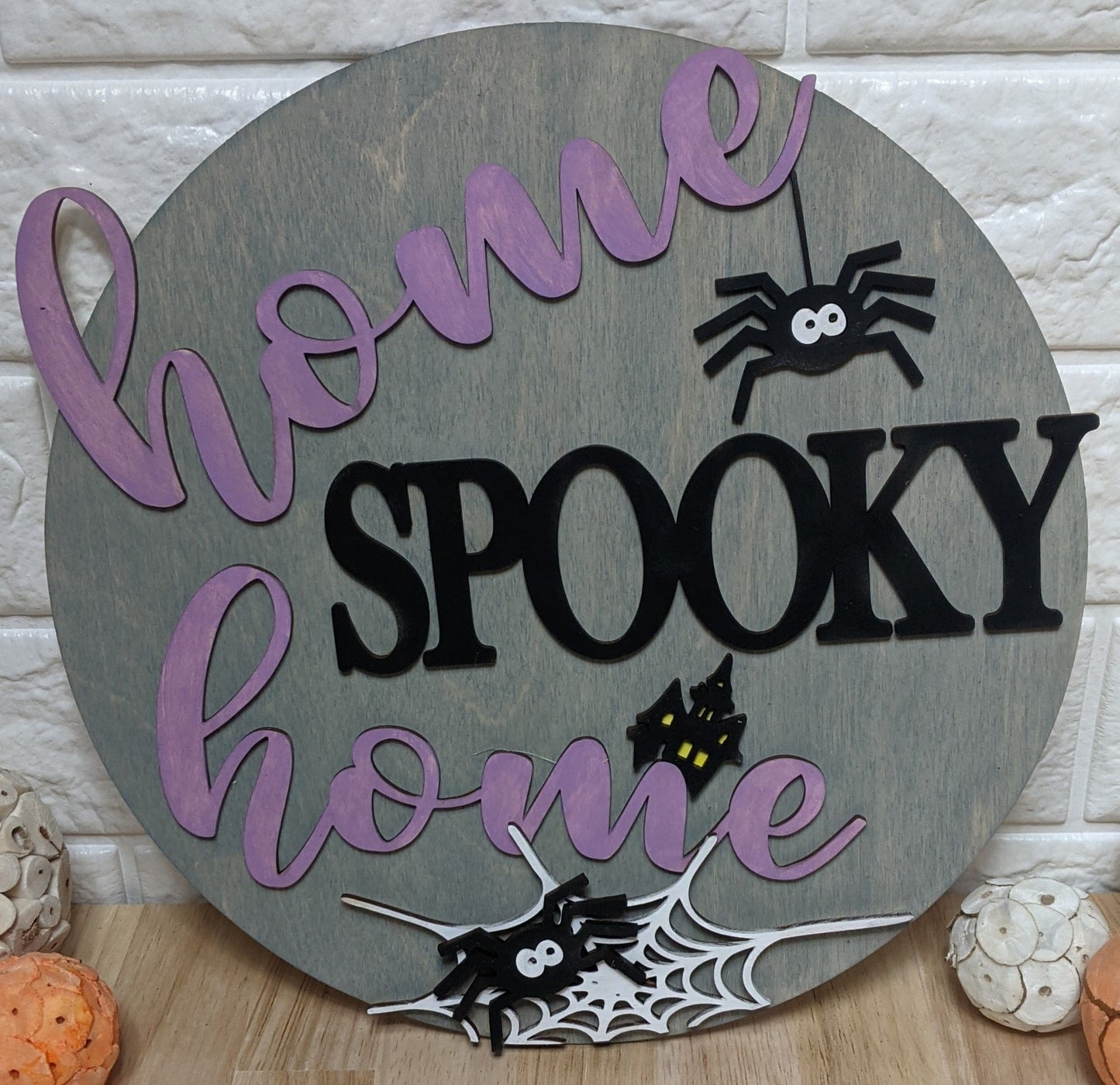 Halloween Round Sign: Home spooky home with spiders.